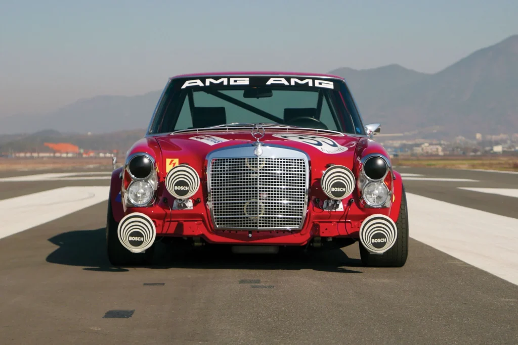 The legendary 1971 Mercedes Red Pig (original and replica) that started it all with its bold red paint and huge presence.